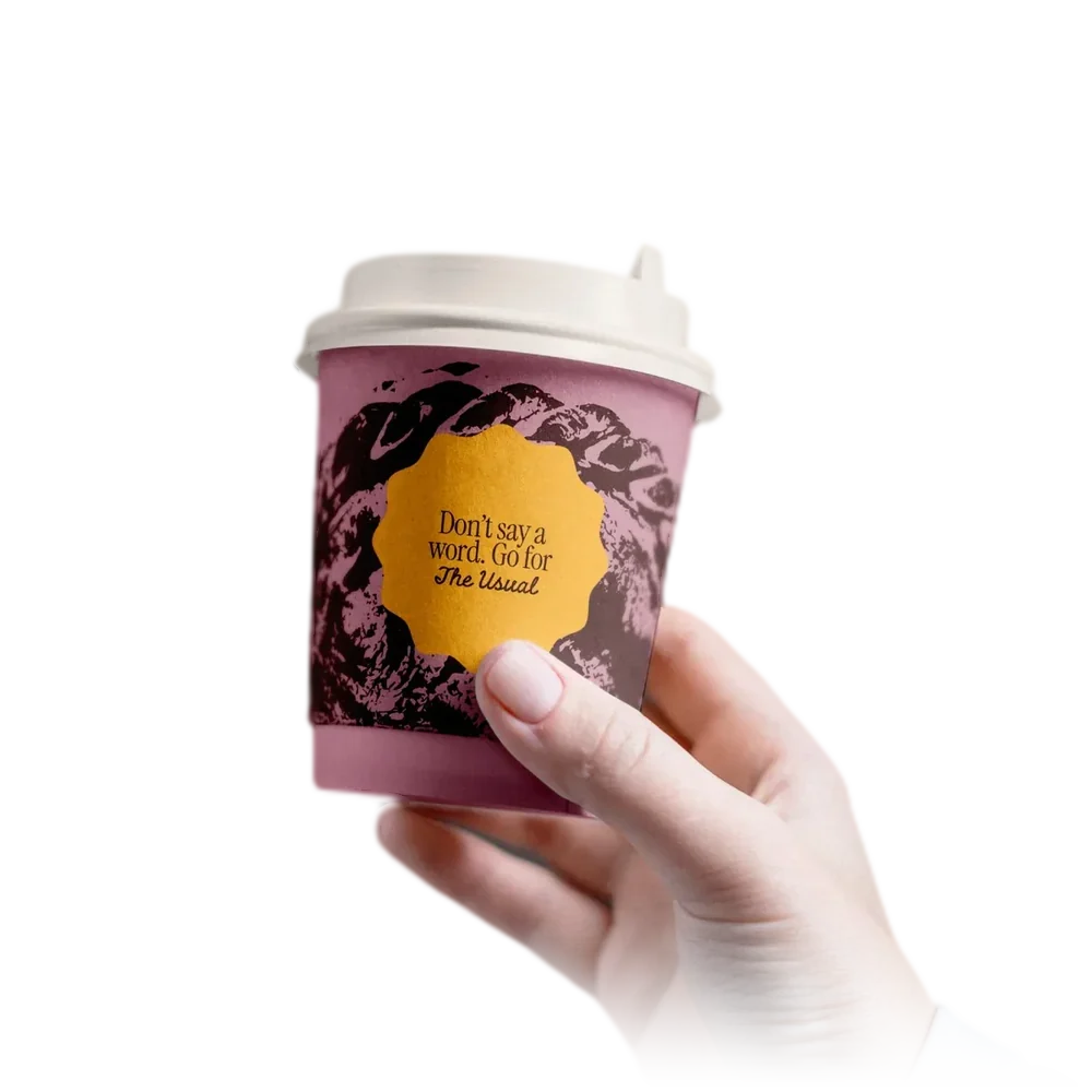 The Usual pink coffee cup, Don’t say a word. Go for The Usual, held in one hand