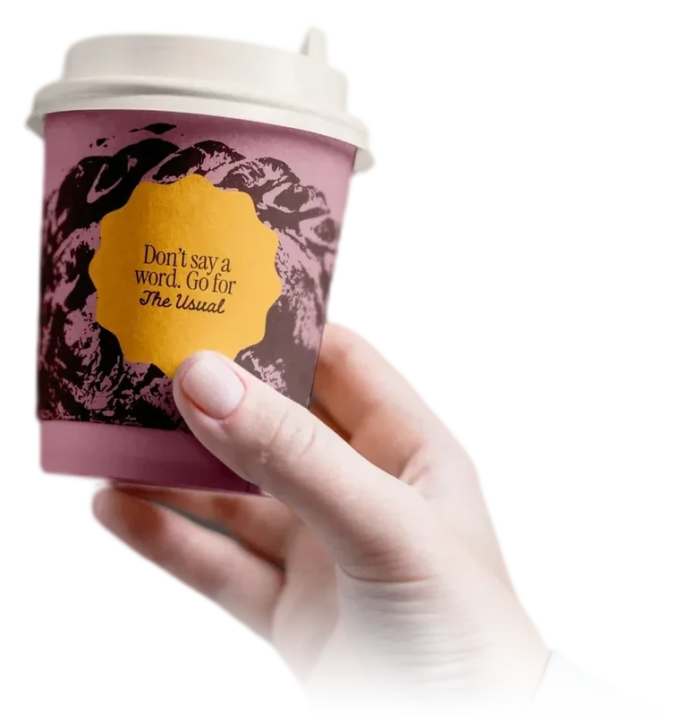The Usual pink coffee cup, Don’t say a word. Go for The Usual, held in one hand